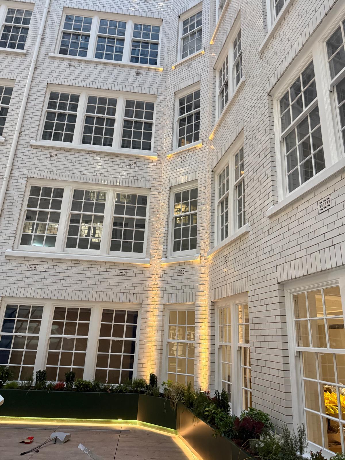 A&D Electrical Sunlight House lighting project — courtyard brickwork uplighting