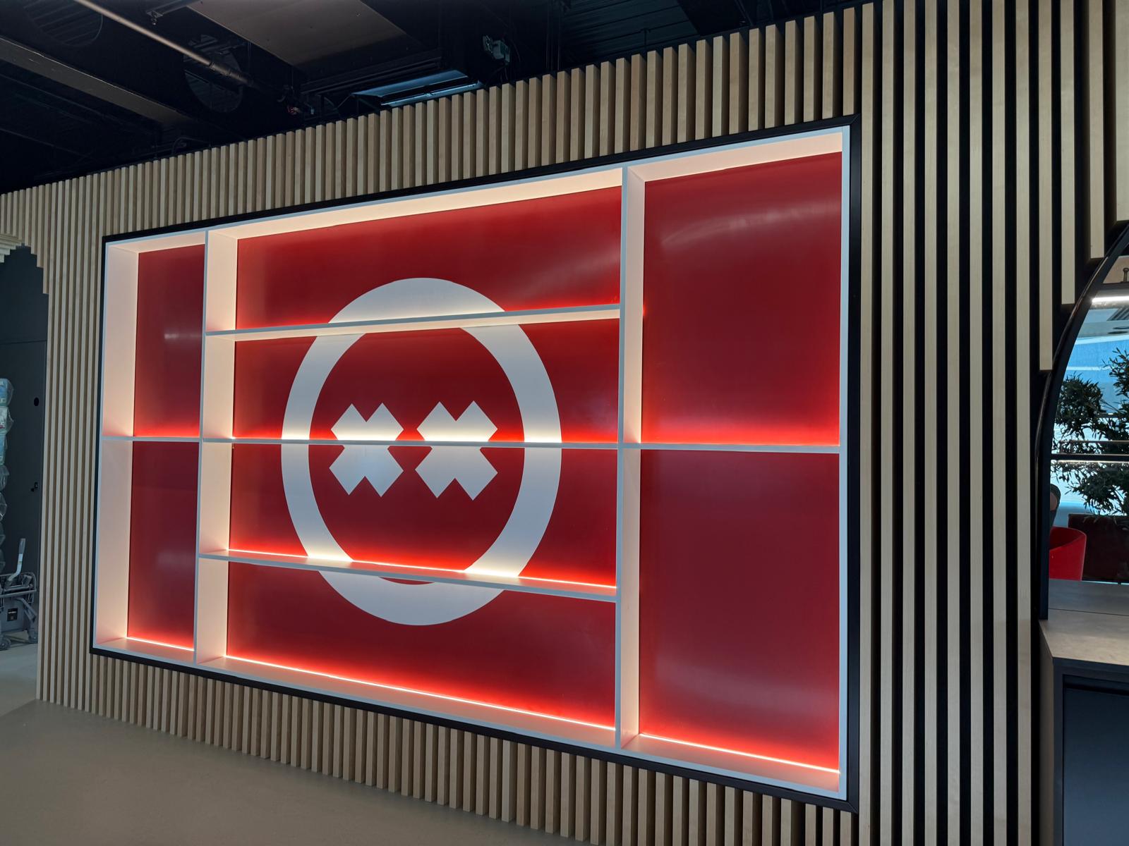 Bespoke LED-lit trophy display and feature joinery installed by A&D Electrical in a Birmingham video game company office
