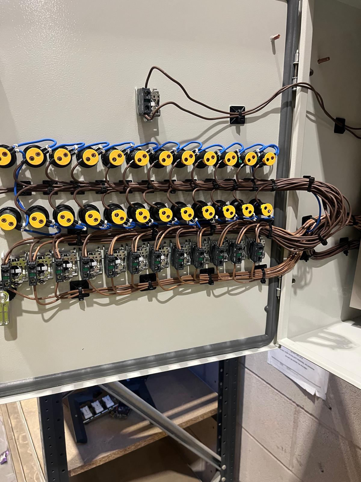 Warehouse lighting contactor panel with neatly routed control wiring and terminations